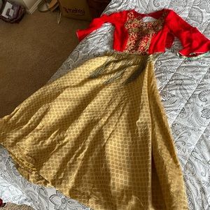 Indian lehenga with gold skirt and red blouse